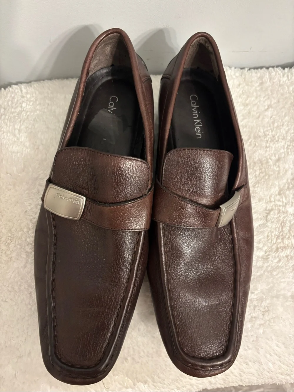 Calvin Klein Men's Dark Brown Leather Slip-Ons with Silver Logo Accent